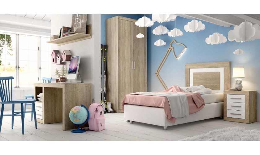Dormitorio infantil compuesto de cama, cómoda, armario y mesa de escritorio de madera con acabados en madera color blanco